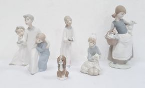 Lladro puppy, a Lladro figure of a young boy with sheep, a Lladro cherub, a Lladro figure of a