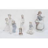 Lladro puppy, a Lladro figure of a young boy with sheep, a Lladro cherub, a Lladro figure of a