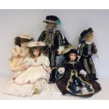 Pair of modern collectors dolls of a boy and girl in matching purple velvet and gilt thread