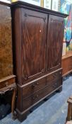 19th century mahogany linen press, the ogee moulded cornice above Greek key decoration, two doors