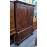 19th century mahogany linen press, the ogee moulded cornice above Greek key decoration, two doors