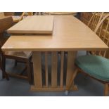 20th century light oak extending dining table on pillar end supports