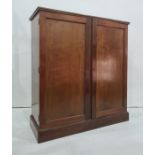 Late 19th/early 20th century walnut two-door cupboard, the rectangular top with moulded edge above