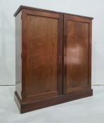 Late 19th/early 20th century walnut two-door cupboard, the rectangular top with moulded edge above