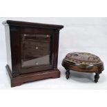 Mahogany cabinet of small proportions, moulded corners above glazed door enclosing four drawers,