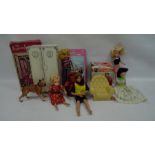 Box of vintage Sindy and Barbie dolls, some with clothing and loose Sindy furniture and accessories