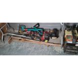A collection of petrol and electric garden power tools including two petrol and one Black and Decker