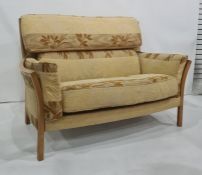 Three seater and two seater sofa by Ercol in a gold ground foliate patterned upholstery (3)