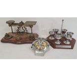 Pair of postal scales on mahogany base with brass weights and a set of chrome eggcups , a enamel and