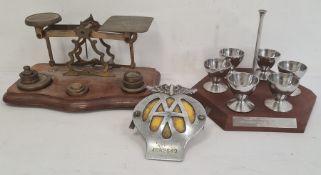 Pair of postal scales on mahogany base with brass weights and a set of chrome eggcups , a enamel and