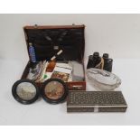 Pair of Swift Triton 7x.35 binoculars, a quantity of shells, two pot lids, a leather suitcase and