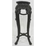Anglo-Indian jardiniere stand with pink veined marble top, heavily carved and pierced ebonised base,