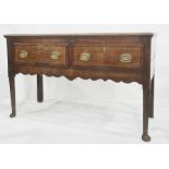 George III oak sideboard having ogee moulded edge, the two frieze drawers with crossbanding, later