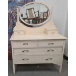 Cream painted dressing chest, the oval mirror above two short and two long drawers, on square