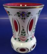 Victorian glass vase, of flared form, the opaque white overlay cut to show ruby flashes and