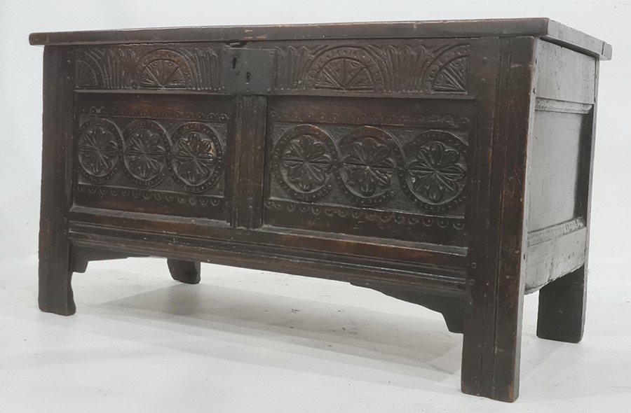 Possibly 18th century oak coffer having triple framed panel top, lunette carved frieze, the two