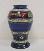 Moorcroft pottery 'Banded Pomegranate' vase, inverse baluster shaped and on a washed blue ground,