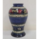 Moorcroft pottery 'Banded Pomegranate' vase, inverse baluster shaped and on a washed blue ground,