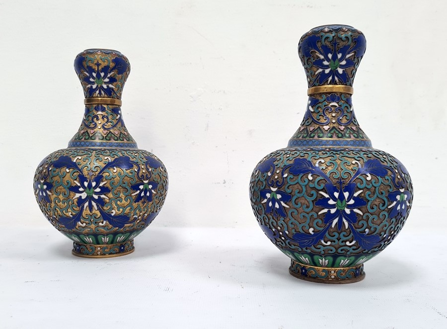 Pair 20th century Chinese cloisonne enamelled vases, baluster shaped and with blue and white lotus