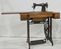 Treadle sewing machine by Youth