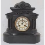 Black slate mantel clock with Roman numerals to the dial