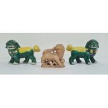 Pair Chinese green and yellow glazed Buddhist lions, 11cm and a carved soapstone model of a lion,