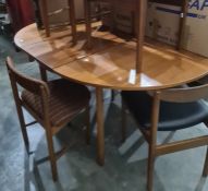 Mid century teak McIntosh extending dining table and four chairs and two similar mid 20th century