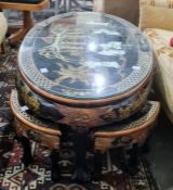 Modern Chinese style oval coffee table with nesting tables under, black ground and gilt decorated