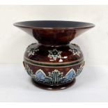 Doulton Lambeth spittoon vase of circular form with flared rim, decorated with stylised leaves and