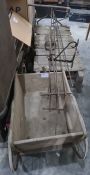 A child's antique garden cart, an old flat bed garden trolley with iron pull and a cast iron rack (