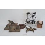 Two brass doorlocks and various castors, a box of  lead "serpent" labels, a microscope and various