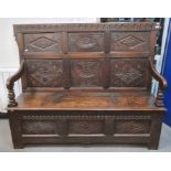 19th century oak bench with carved panelled back, lift-top box seat, fronted by three diamond carved