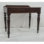 19th century mahogany writing table, the rectangular top with galleried back, rounded front corners,