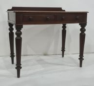 19th century mahogany writing table, the rectangular top with galleried back, rounded front corners,