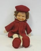 Vintage doll with felt head and cloth body, in red woollen dress, approximately 40cm long