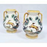 Pair of two-handled pottery vases, probably Italian, decorated with deer and trees within yellow