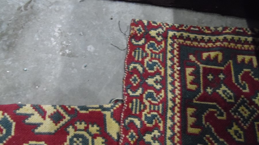 Heavily cut down rug, the red ground with allover foliate pattern, with alterations, notches, cut, - Image 5 of 6