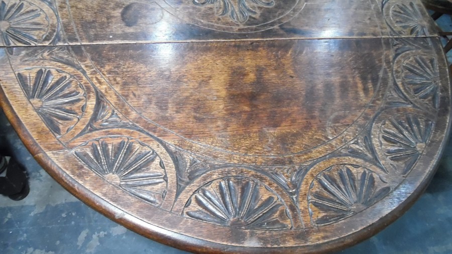 Late 19th century oak gateleg table, the top with carved decoration, on turned and block legs, - Image 3 of 5
