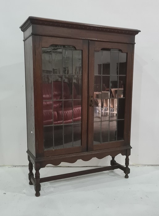 20th century oak display cabinet, the rectangular top with moulded edge above two lead glazed