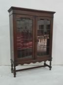 20th century oak display cabinet, the rectangular top with moulded edge above two lead glazed