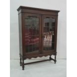 20th century oak display cabinet, the rectangular top with moulded edge above two lead glazed