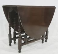20th century gateleg oval table on turned and block supports, stretchered base