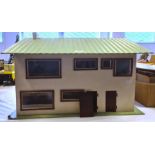 20th century doll's house with lift-up roof and front opening with green roof and white painted