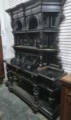 19th century ebonised dresser with cavetto moulded cornice above assorted shelves, to breakfront