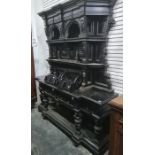 19th century ebonised dresser with cavetto moulded cornice above assorted shelves, to breakfront