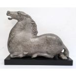 Silvered plaster model of a kneeling horse, on rectangular plinth, 40cm high