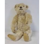 Miniature Steiff teddy bear with stud to ear, 22cm long approx, boot button eyes Condition ReportThe