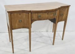 19th century mahogany sideboard with serpentine front, the central drawer flanked by cellarette