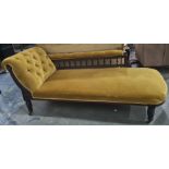 Victorian chaise longue in mustard yellow ground, turned front supports, brown china castors
