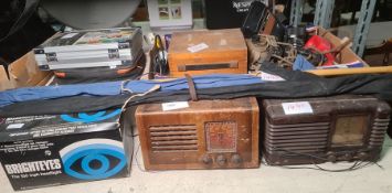 Two vintage radios, a boxed Lucas headlight x 2, vintage a volt watt meter, a WWII pilot's